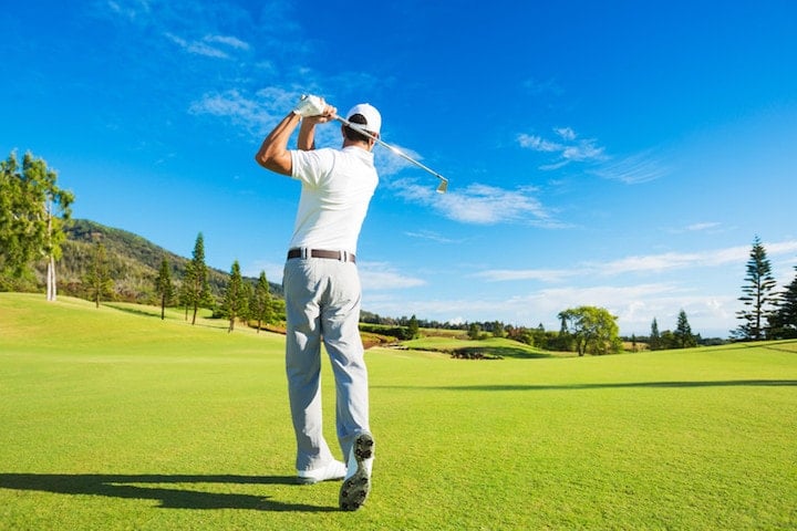 golfer swinging back view