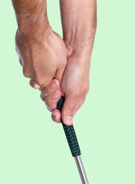 hand gripping club