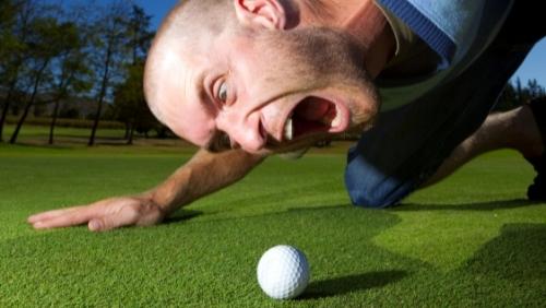 man shouting at the golf ball