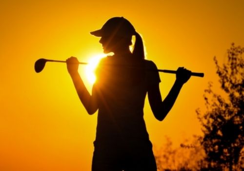 woman golfing silhouette