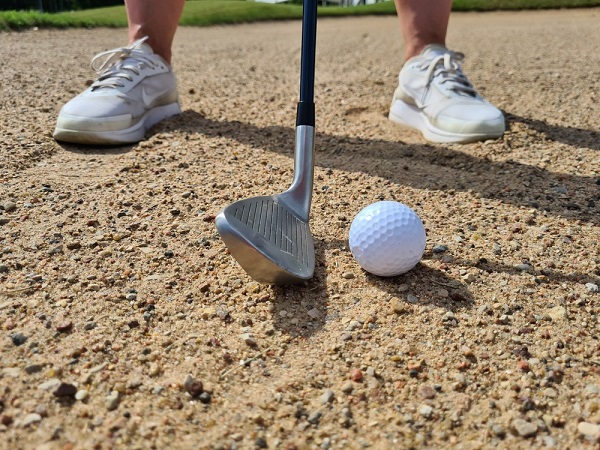 Golf shot from sand bunker