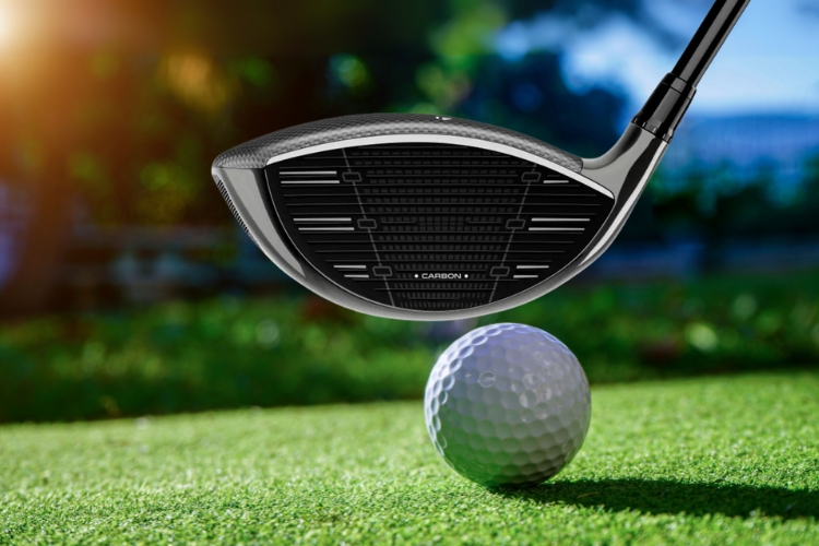 TaylorMade Qi35 Driver aiming golf ball