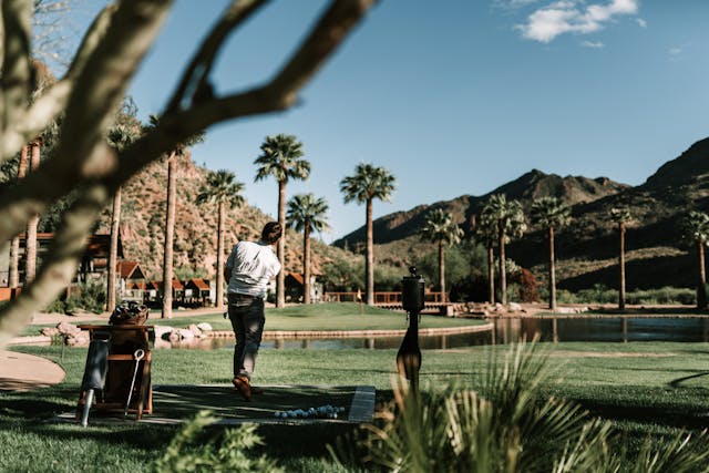 golfer swinging club back view